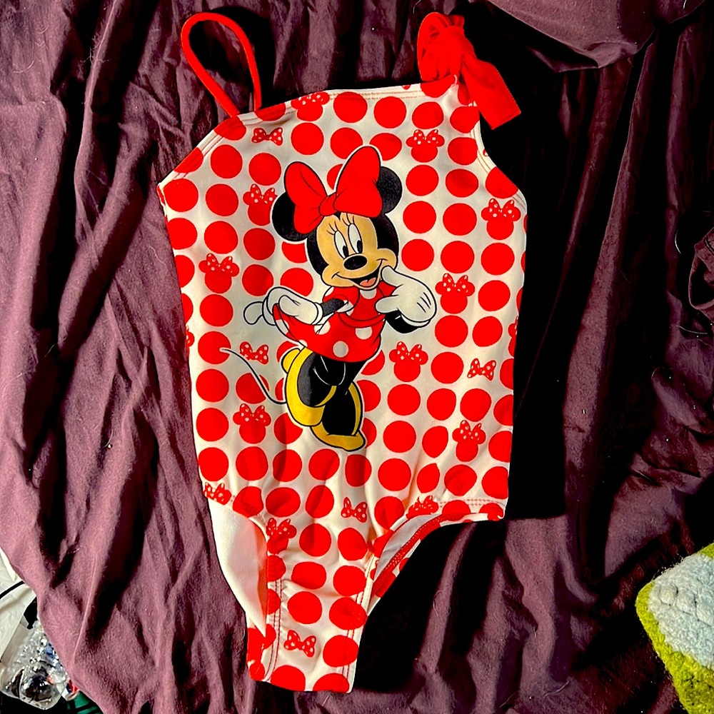 Mini mouse bathing suit white and red . Tue bow on one side slightly used